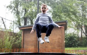 boy bouncing on a trampoline at centre 56