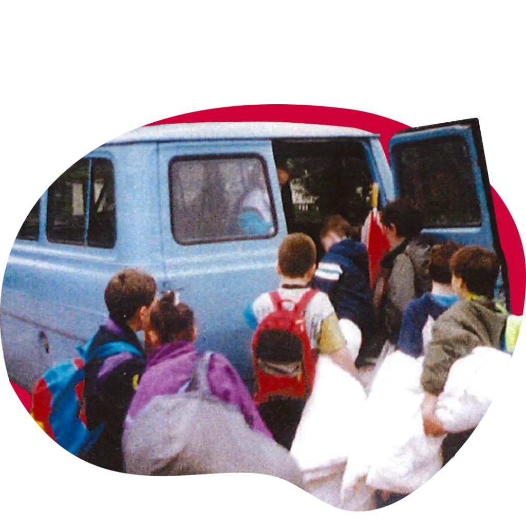 old photo of children enter van at centre 56